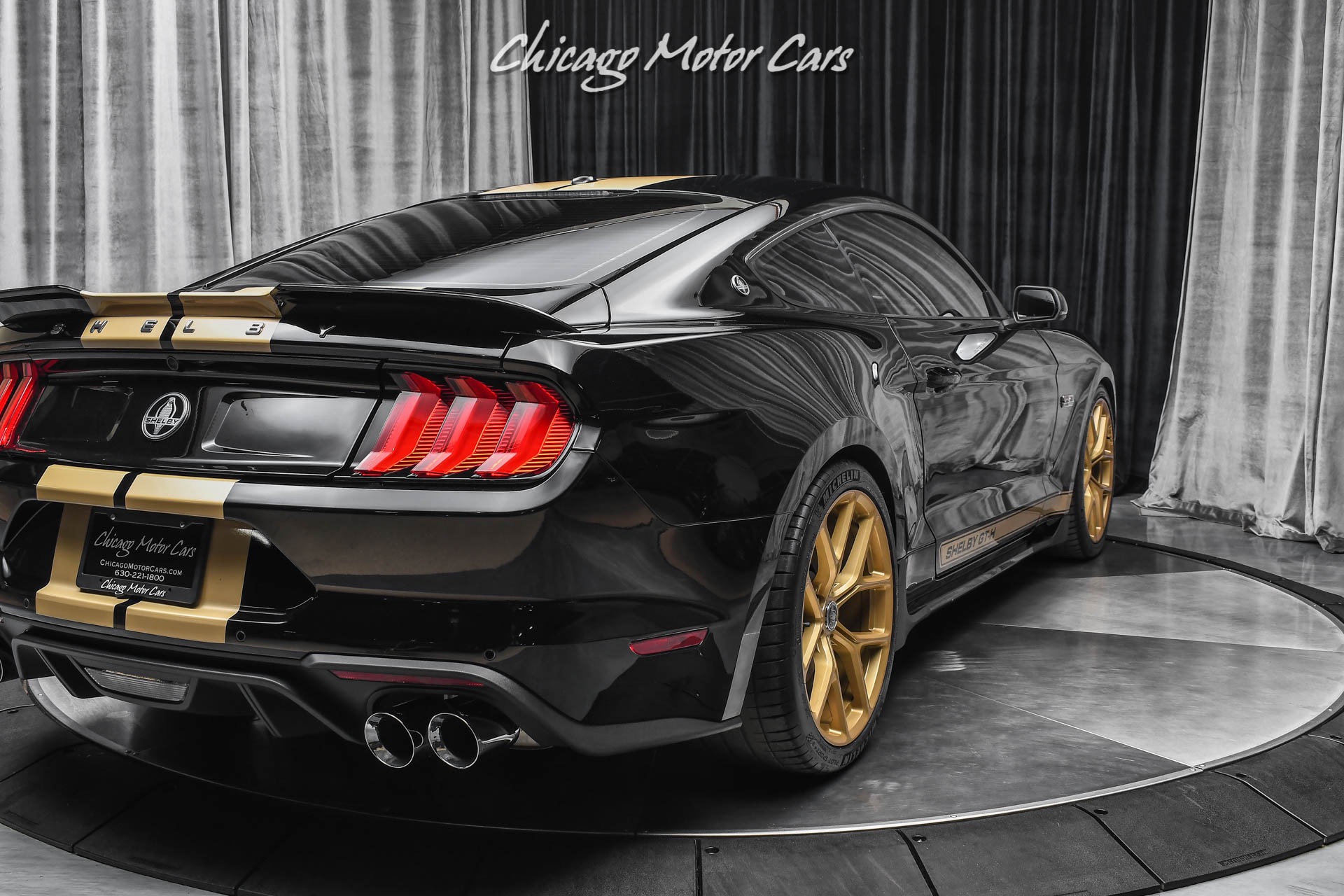 black mustang gold rims