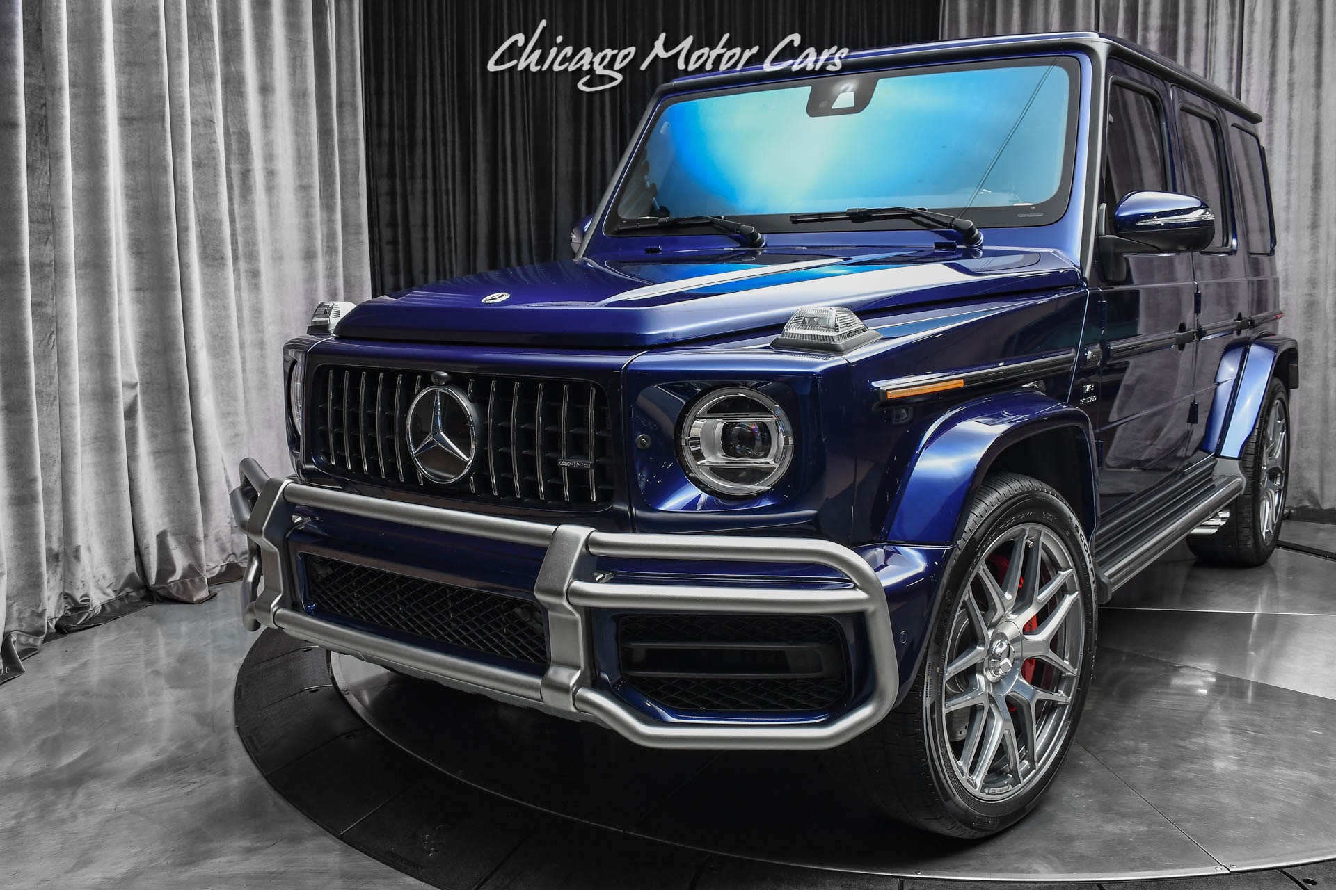https://www.chicagomotorcars.com/imagetag/8262/39/l/Used-2021-Mercedes-Benz-G63-AMG-SUV-RARE-Designo-Mystic-Blue-ONLY-1900-Miles-Exclusive-Interior-Pack.jpg